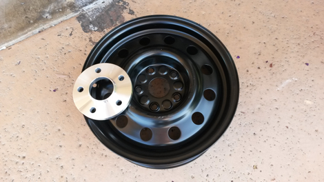 One of the new wheels with the spacer needed to make it work.Note the difference in size between the wider center hole of the spacer and the smaller hole in the wheel. This is why Markwardt had to machine out a bigger space for the hub.